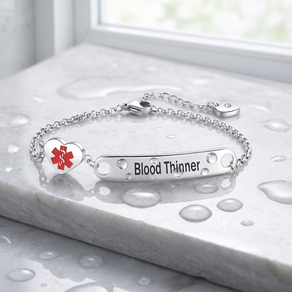 Waterproof Blood Thinner medical ID bracelet with water droplets on a wet stone
