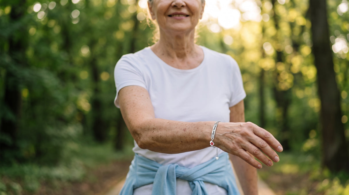 Woman on a morning walk in the park wearing a Blood Thinner medical ID bracelet